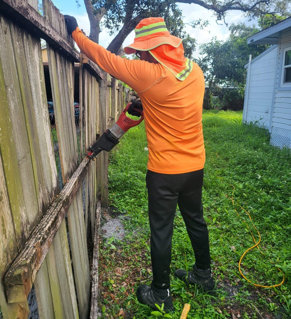 Wooden fence being removed
